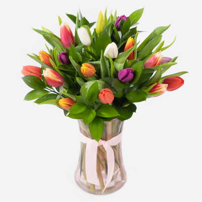 Spring Kisses - This glass vase filled with beautiful tulips is the epitome of spring and is the perfect way to share your love.
